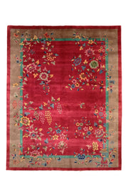 Antique Chinese Art Deco Walter Nichols rug, 138x110 inches, featuring a vibrant ruby field adorned with scattered blossoms and vases, framed by jade and taupe borders.